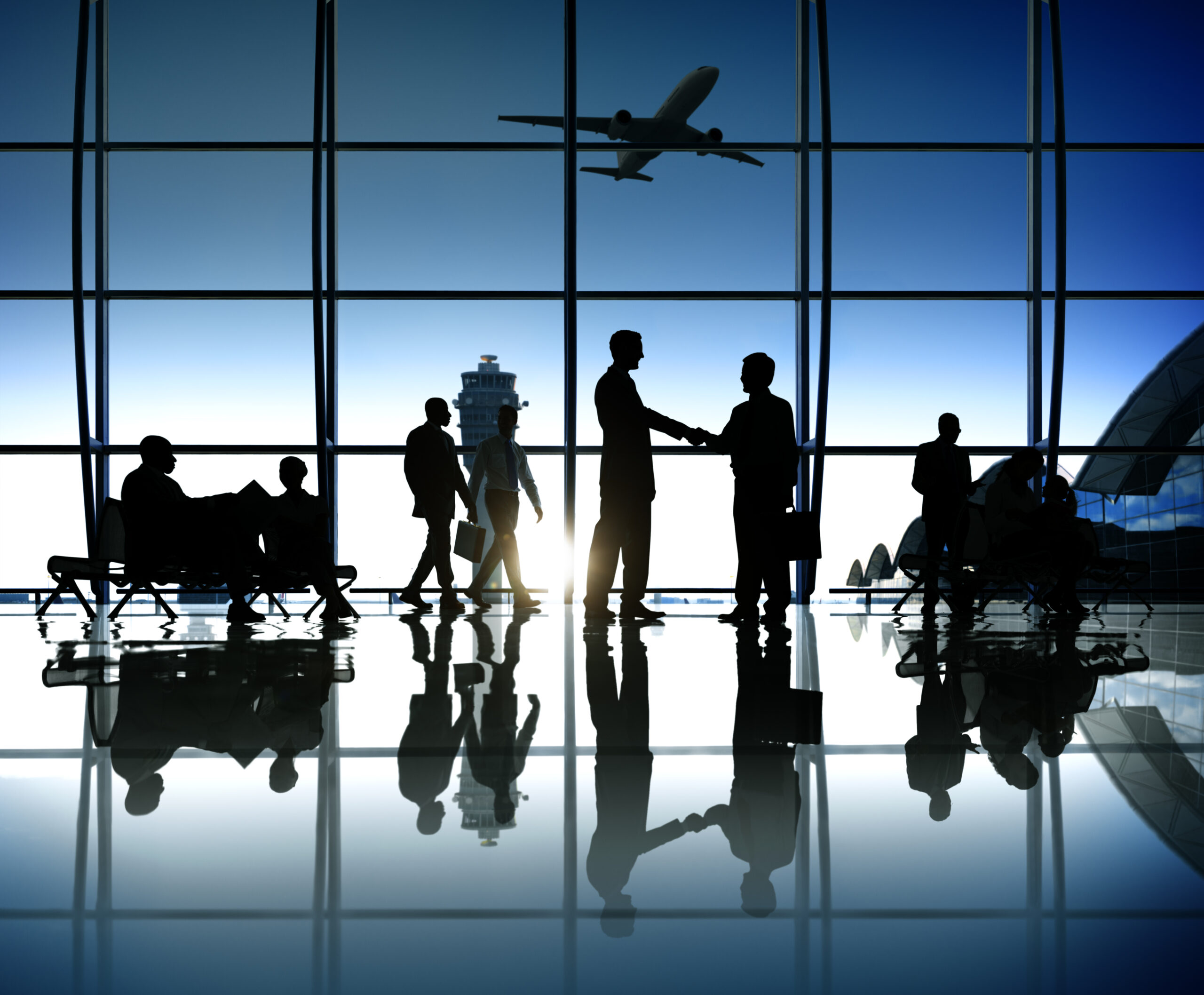 business people at an airport discussing new trade markets