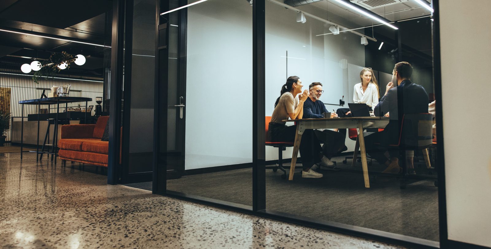 Workers in an office discussing the 2024 Fall Economic Statement